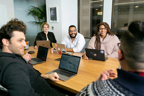 A group of people in a meeting