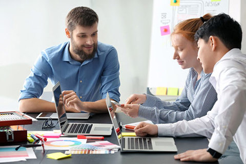 Three people in an office