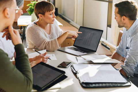 A group of people in a team meeting