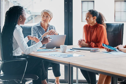 Three women in a meeting