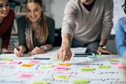 A group of people in a project planning meeting