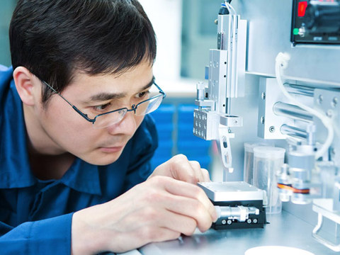 A man working on a measuring instrument