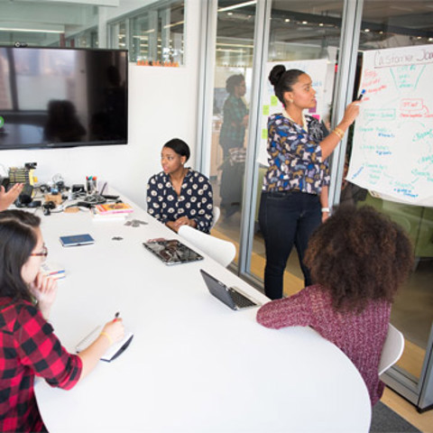 A group of people in a meeting