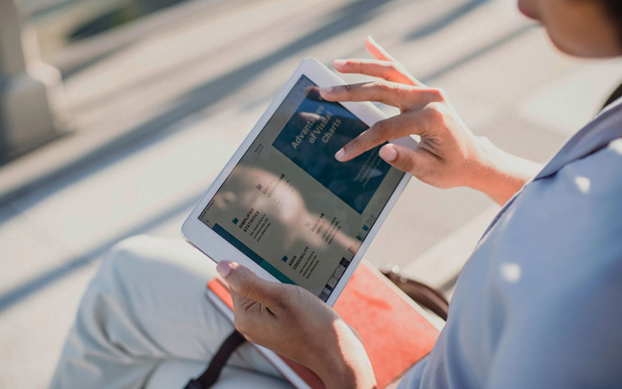 A person browsing a web page on a tablet device