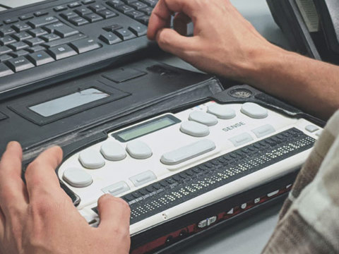 A person using a keyboard assistant