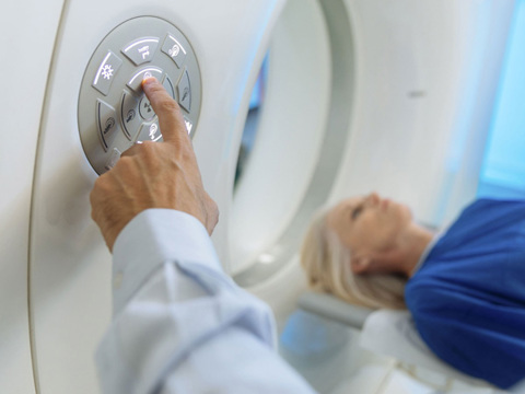 A women in an x-ray machine