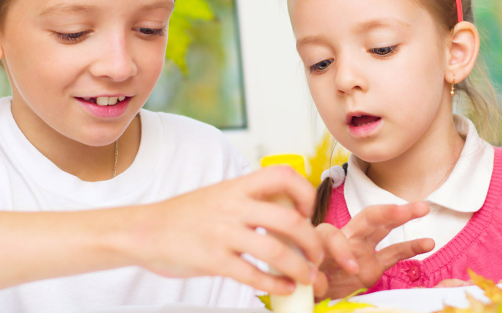 Two children learning artwork