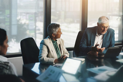A group of people in a office meeting room