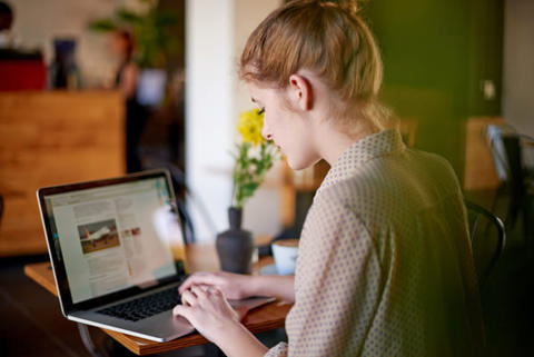 A woman working on a laptop