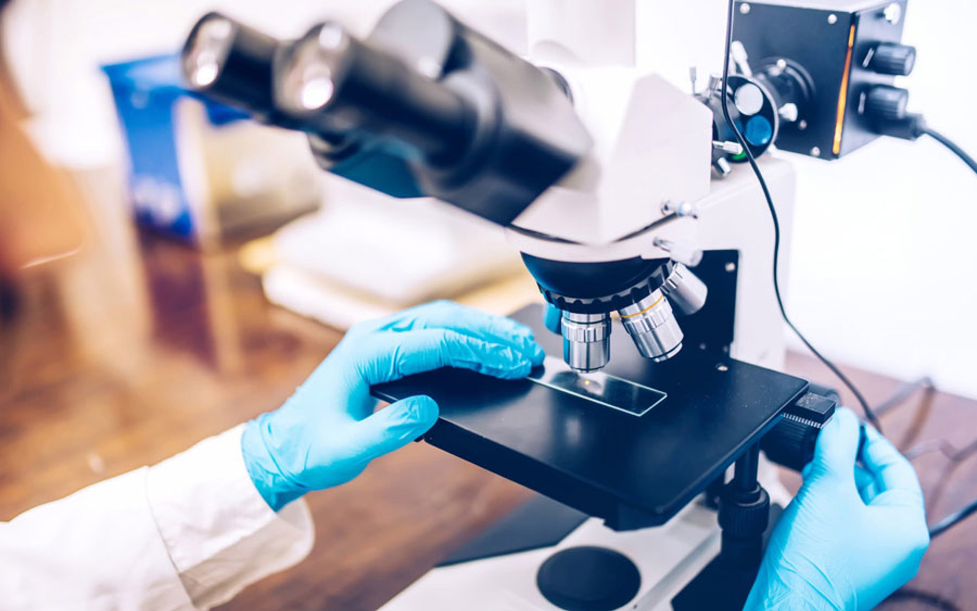 A person working on a microscope