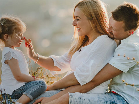 A woman, a man and a child