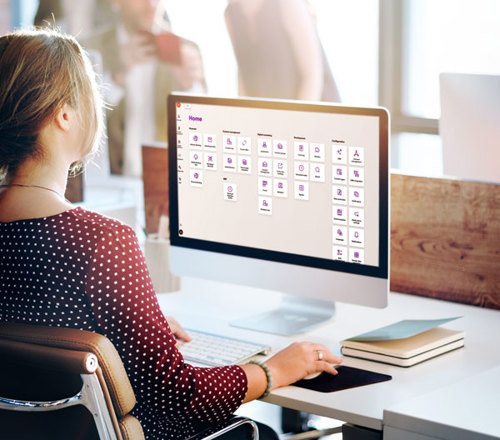 A woman seating a computer workstation