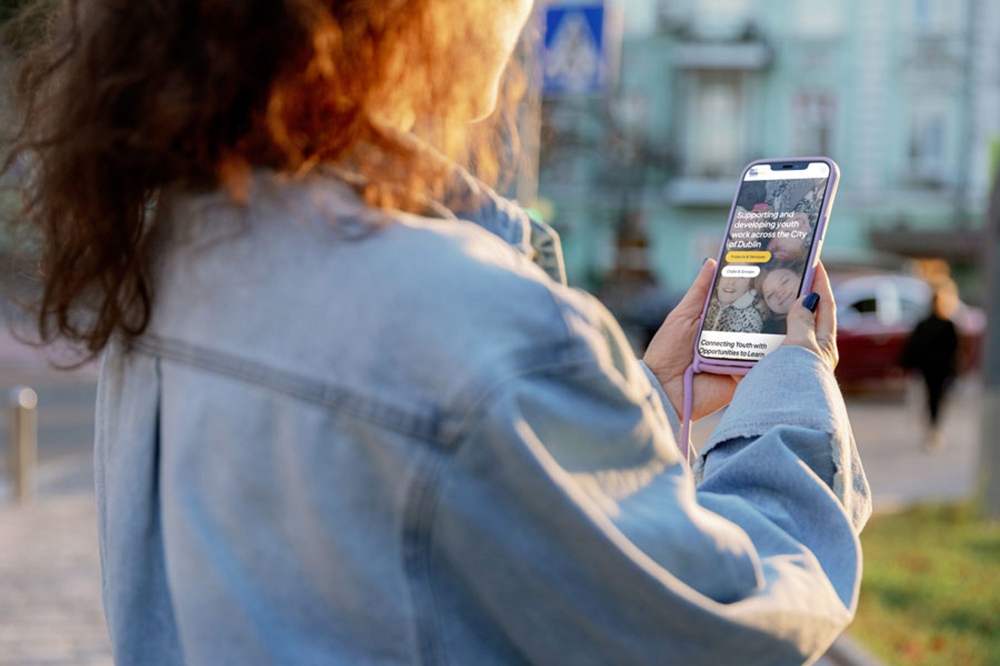A woman holding a mobile phone