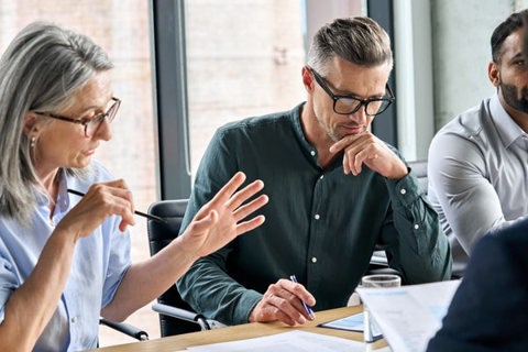 Four people in a meeting