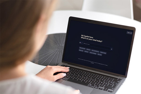 A woman working on a laptop