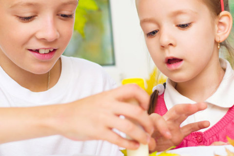 Two children in a classroom learning